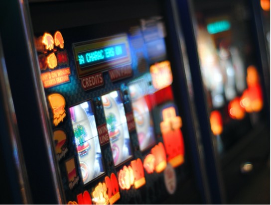 Close up image of a lit-up slot machine