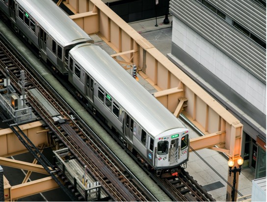 Overhead view of a train on elevated tracks